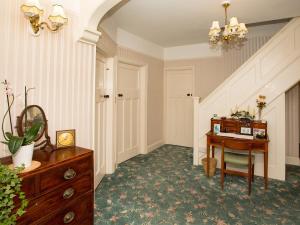 a room with a desk and a chair and a table at Eypeleaze B&B in Bridport