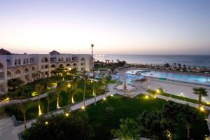 an aerial view of a resort with the ocean in the background at Old Palace Resort Sahl Hasheesh in Hurghada