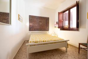 Posteľ alebo postele v izbe v ubytovaní Casa Lisa a due passi dal mare con ampio giardino