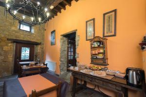 a dining room with a table with food on it at Posada de la Abadia - Adults Only in Santillana del Mar