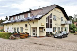 a building with a car parked in front of it at Pfaelzer Stuben in Landstuhl