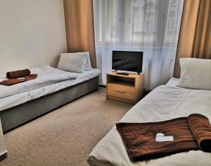 Postel nebo postele na pokoji v ubytování Hotel Marianeum