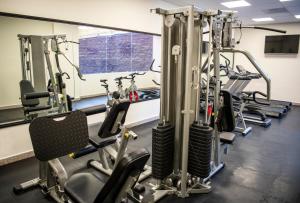 a gym with several treadmills and cardio machines at Comfort Inn Irapuato in Irapuato