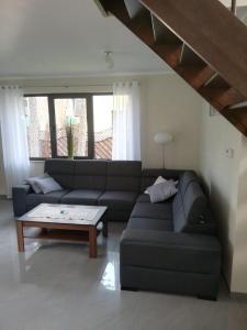 a living room with a couch and a coffee table at Willa nad morzem in Pobierowo