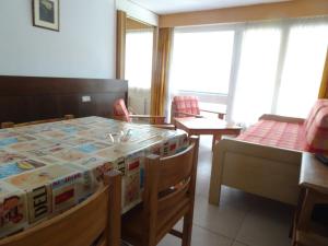 a room with a table with a box on it at Fortuna 216 und 116 in Leukerbad