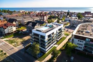 an aerial view of a city with a large building at HELove Apartamenty in Hel
