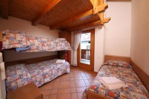 Postel nebo postele na pokoji v ubytování Residenza Al Castello