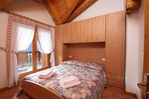 Postel nebo postele na pokoji v ubytování Residenza Al Castello