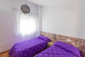 Posteľ alebo postele v izbe v ubytovaní Alojamientos Madrigal 1 y Madrigal 2