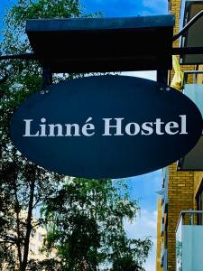 a sign for a line hospital on a street at Linné Hostel in Gothenburg