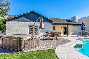 a hot tub in the backyard of a house at Bell Villa - Resort Living - Pool - Location - Events in Phoenix