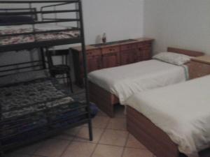 Postel nebo postele na pokoji v ubytování lontani da casa