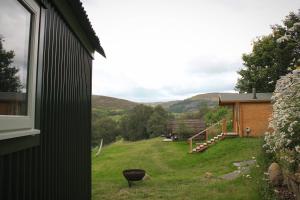 a view of a yard from a house at Howe of Torbeg in Ballater