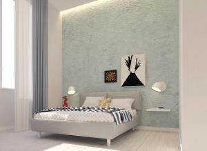 a bedroom with a bed and a green wall at N'Agorà B&B in Naples +2 photos