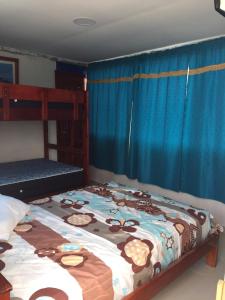 Postel nebo postele na pokoji v ubytování Hostal Sarai