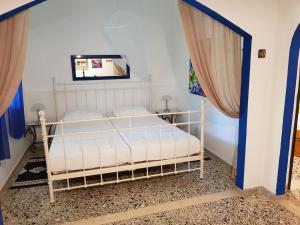 A bed or beds in a room at Villa Archontou