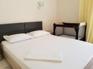 Postel nebo postele na pokoji v ubytování Galini Apartment