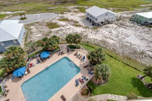 an aerial view of a swimming pool and a house at The Dunes #707 in Gulf Shores