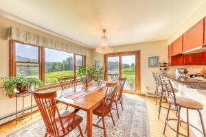 a kitchen and dining room with a table and chairs at Vermont Getaway in Waterbury Center