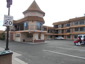 a parking lot in front of a large building at Victorian Inn in Reno