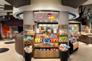 a grocery store with a large assortment of food at Tru By Hilton Edinburg in Edinburg