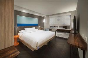 Postel nebo postele na pokoji v ubytování Tru By Hilton Edinburg + 3 fotografie