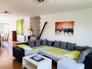 a living room with a couch and a table at Villa Ceki in Zadar