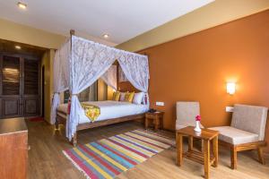 Letto o letti in una camera di Hotel Mala Pokhara