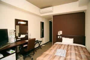 Katil atau katil-katil dalam bilik di Hotel Route-Inn Tokuyama Ekimae