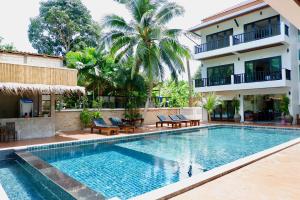 a swimming pool in front of a building at Aiya Resort Koh-Tao in Ko Tao