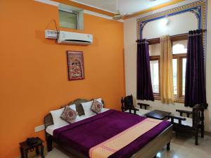 מיטה או מיטות בחדר ב-Hotel Tiger Haveli