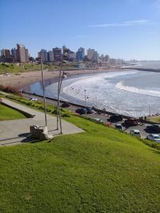a view of a beach with cars parked on the sand at DESCANSO IDEAL II CABO CORRIENTES in Mar del Plata