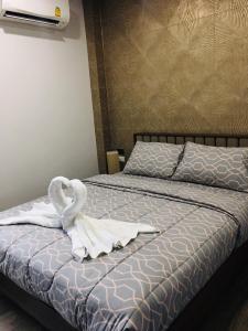 Llit o llits en una habitació de SB Holiday Resort Chiang Mai