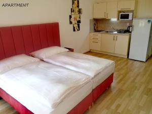 Postel nebo postele na pokoji v ubytování Hotel Otakar