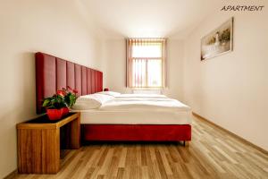 Postel nebo postele na pokoji v ubytování Hotel Otakar