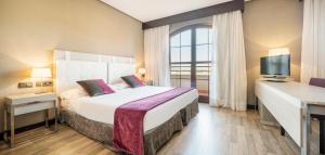 Cama o camas de una habitación en Ilunion Golf Badajoz