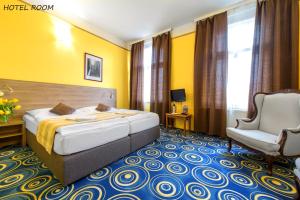 מיטה או מיטות בחדר ב-Hotel Otakar
