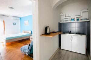 Kuchyň nebo kuchyňský kout v ubytování Apartments Carpe Diem