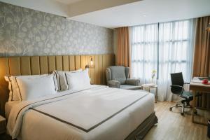 Postel nebo postele na pokoji v ubytování Barito Mansion