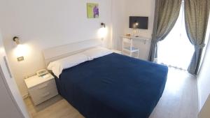 Katil atau katil-katil dalam bilik di Hotel Alberello