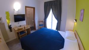 Katil atau katil-katil dalam bilik di Hotel Alberello