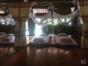Postel nebo postele na pokoji v ubytování Vu Linh Homestay