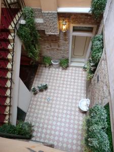 
a hallway that has a bunch of stairs in it at Locanda Cà Le Vele in Venice
