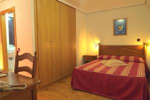 Postel nebo postele na pokoji v ubytování Hotel Jacobeo