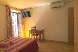 Postel nebo postele na pokoji v ubytování Hotel Jacobeo