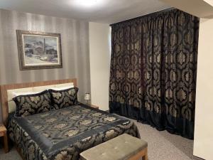 Bononia Hotel tesisinde bir odada yatak veya yataklar