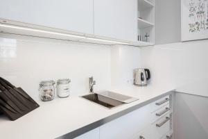 Kuchyňa alebo kuchynka v ubytovaní Apartments City Center by Noclegi Renters