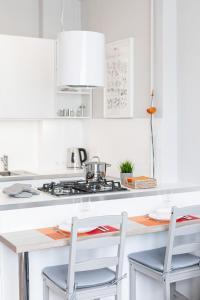 Kuchyňa alebo kuchynka v ubytovaní Apartments City Center by Noclegi Renters