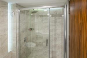a shower with a glass door in a bathroom at The Sign Esentepe Hotel&Kayak Merkezi in Gerede +26 photos
