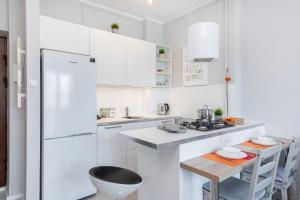Kuchyňa alebo kuchynka v ubytovaní Apartments City Center by Noclegi Renters